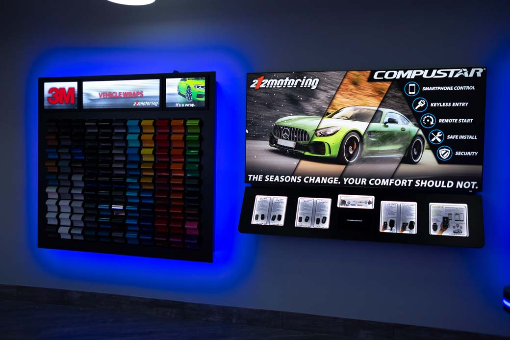 Interior of the 212 Motoring shop: A display showcasing different vehicle wraps