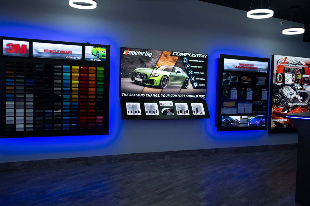 Interior of the 212 Motoring shop: A display showcasing different vehicle wraps