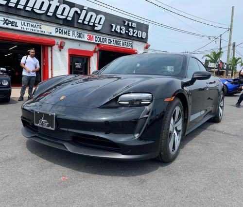 Black Ferrari in front of 212 Motoring