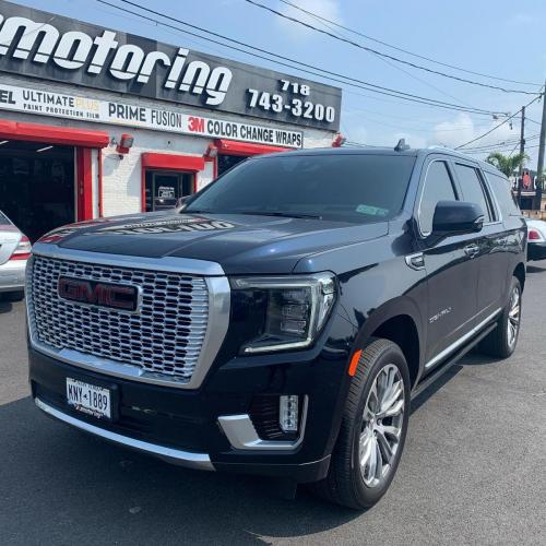 Black GMC Denali in front of 212 Motoring