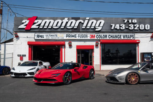 Three sports cars outside of 212 Motoring